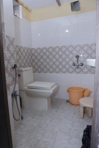 a bathroom with a toilet and a sink at 3 BHK-Air Coolers for 4 to 10 Guests for Families in Hyderabad
