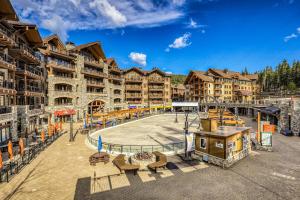 an apartment complex with a playground in front of a building at Northstar Village #410 in Kingswood Estates