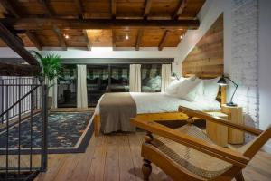 a bedroom with a large bed and a staircase at Fiori e Spezie in Lomazzo