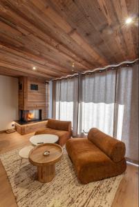 a living room with a couch and a table at Modern apartment in Megeve near ski lifts in Megève