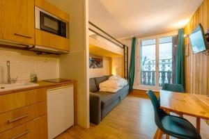 Televízia a/alebo spoločenská miestnosť v ubytovaní Chamonix Sud - Forclaz 304 - Happy Rentals