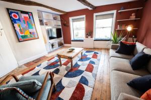 a living room with a couch and a coffee table at 72 - Quirky One Bed Property in the Norwich Lanes in Norwich