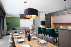 a dining room with a table and chairs at Villa Tiki in Medulin for 16 person with heated pool & sauna only 1 km from the beach in Medulin