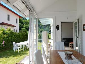 a kitchen and dining room with a sliding glass door at Villa Schaller - Apartment in Krumpendorf am Wörthersee