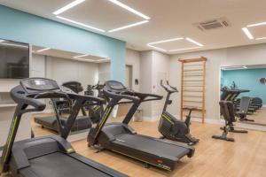 a gym with several exercise bikes in a room at Wize in Sao Paulo
