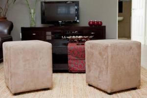 two stools in front of a tv in a living room at Home away from home in Windhoek