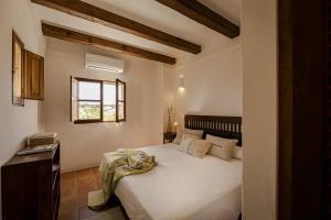 Posteľ alebo postele v izbe v ubytovaní Can Noves - Villa de 5 suites 28 y 58