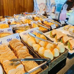 a buffet filled with sandwiches and other sandwiches at Salinas Exclusive Resort in Salinópolis
