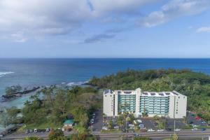 an aerial view of a hotel and the ocean at Ocean view Mauna Loa Shores Kai Ekahi #201 next to Carlsmith Beach Park Hilo HI in Hilo