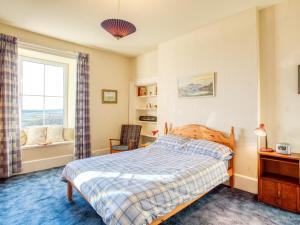 a bedroom with a bed and a window at 3 bed property in Castletown CA416 in Castletown