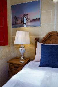 Ένα ή περισσότερα κρεβάτια σε δωμάτιο στο Amaryllis Holiday Home