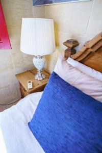 Ένα ή περισσότερα κρεβάτια σε δωμάτιο στο Amaryllis Holiday Home