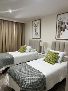 En eller flere senge i et værelse på JM APART CATEGORÍA