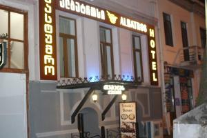 a sign on the side of a building at Hotel Albatros in Batumi