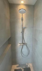 a shower with a shower head in a bathroom at Chita-gun - House - Vacation STAY 13533 in Noma