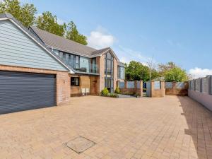 a large brick house with a garage at 4 Bed in Braunton 80379 in Braunton