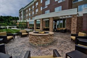 a patio with a fire pit in front of a building at Courtyard by Marriott Bridgeport Clarksburg in Bridgeport