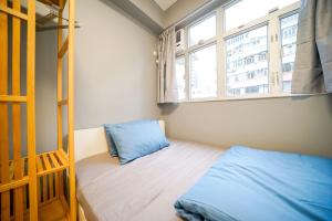 Postel nebo postele na pokoji v ubytování Student Accommodation - 292 Hennessy Road