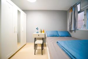 Postel nebo postele na pokoji v ubytování Student Accommodation - 292 Hennessy Road