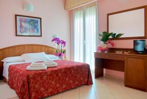 Postel nebo postele na pokoji v ubytování Hotel Driade sul mare
