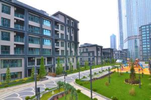 a city street with a building and a park at Luxury Apartment in Istanbul