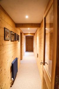 a hallway of a house with wooden walls at The Hayloft at Lower Hurst Farm in Hulme End