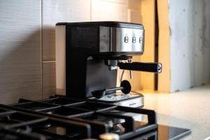 a coffee pot sitting on top of a stove at Superb Stonewall Terrace in London