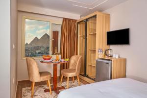 TV a/nebo společenská místnost v ubytování Rotana Pyramids View