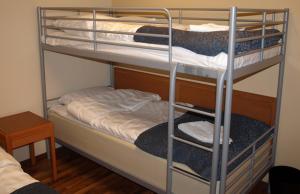 Uma ou mais camas em beliche num quarto em Star Hostel