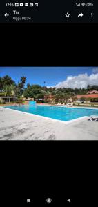 a screenshot of a picture of a swimming pool at Villa sol de samana' in Los Róbalos