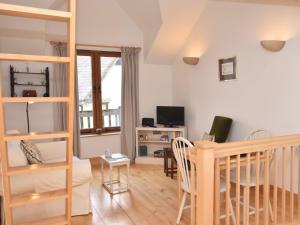 a living room with a loft bed and a desk at 1 bed in Crickhowell 82777 in Crickhowell