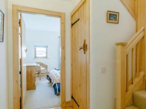 a hallway with a door leading to a room at 1 bed in Crickhowell 82777 in Crickhowell