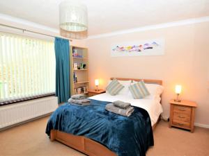 a bedroom with a bed with towels on it at 2 Bed in Cockermouth SZ282 in Cockermouth