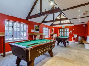 a room with a pool table and a bar at 3 Bed in Dunwich 85183 in Westleton