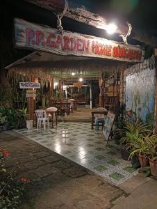 a restaurant with a sign that reads rip garden home banquet at P P Garden Home Bungalow in Phi Phi Islands