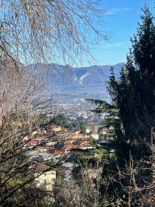 a view of a valley with mountains in the distance at B&B Il Castellaccio - Albavilla in Albavilla