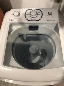 a close up of a washing machine with its door open at Casa próximo ao aeroporto in Rio Largo