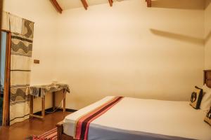 Postel nebo postele na pokoji v ubytování Aloe Vera Guest House