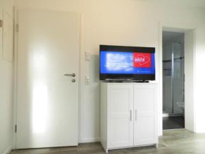 Appartementhaus-Kogge-Wohnung-11 TV 또는 엔터테인먼트 센터