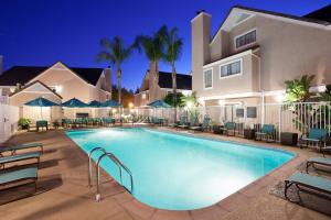 a swimming pool in front of a house at night at Residence Inn Irvine Spectrum in Irvine