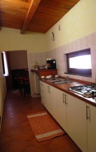 a kitchen with a stove and a counter top at Le Stanze del Re in Lamezia Terme
