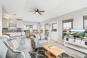 a living room with a couch and a tv at 045 Dooney Dunes in Dauphin Island
