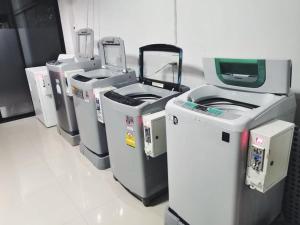a row of machines lined up in a room at Balance room in Ban Khlong Si +14 photos