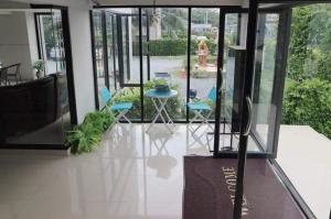 a view of a patio with chairs and a table at Balance room in Ban Khlong Si