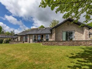 a house with a lawn in front of it at 3 Bed in St. Mellion 87718 in St Mellion