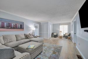 a living room with a couch and a table at 086 DI Big House - 6 Bedrooms in Dauphin Island