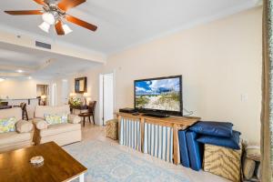 a living room with a flat screen tv at 314 Holiday Isle 314 in Dauphin Island