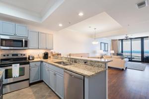 an open kitchen and living room with a view of the ocean at 507 Holiday Isle 507 in Dauphin Island