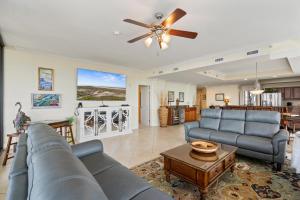 a living room with a couch and a ceiling fan at 701 Holiday Isle 701 in Dauphin Island