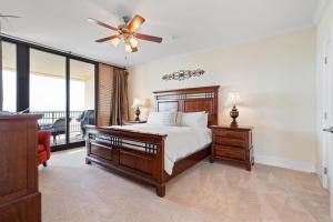 a bedroom with a bed and a ceiling fan at 701 Holiday Isle 701 in Dauphin Island +35 photos